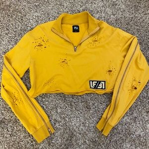 distressed crop top with zipper sleeves